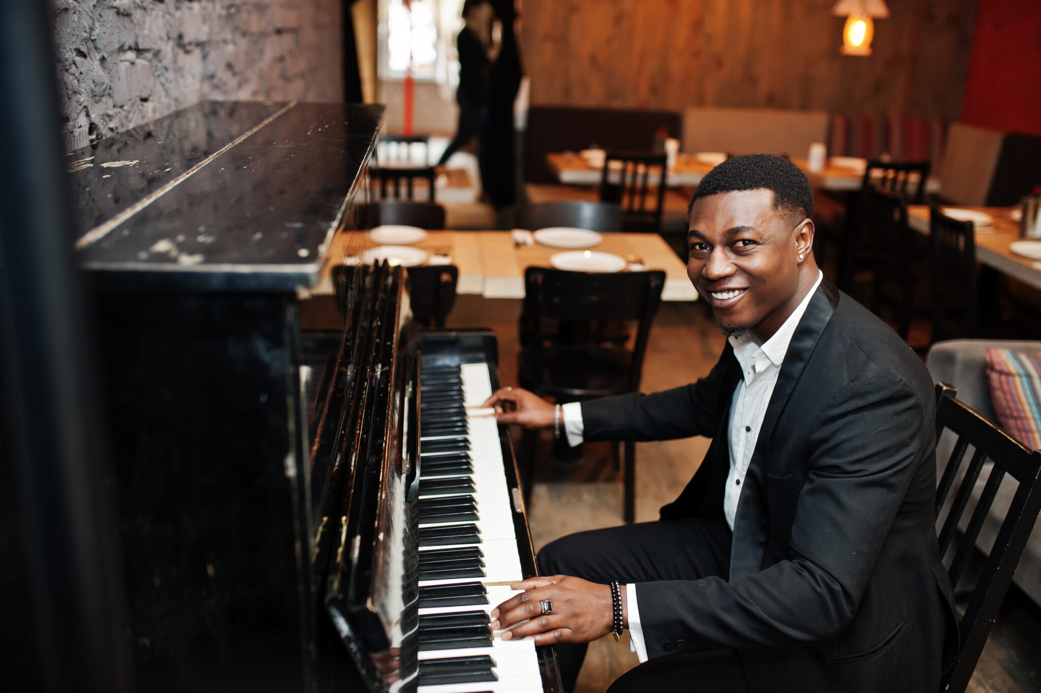 A pianist at an upright piano