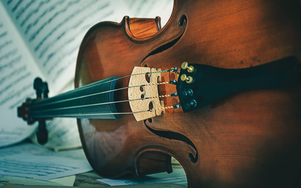 Cello lying on music notes