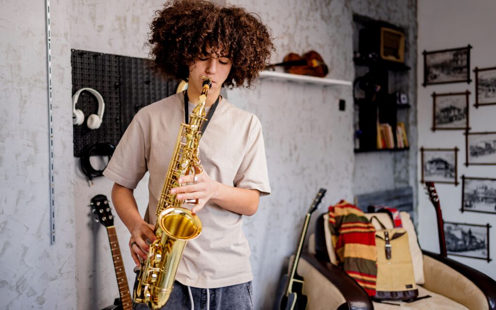 boy playing saxophone