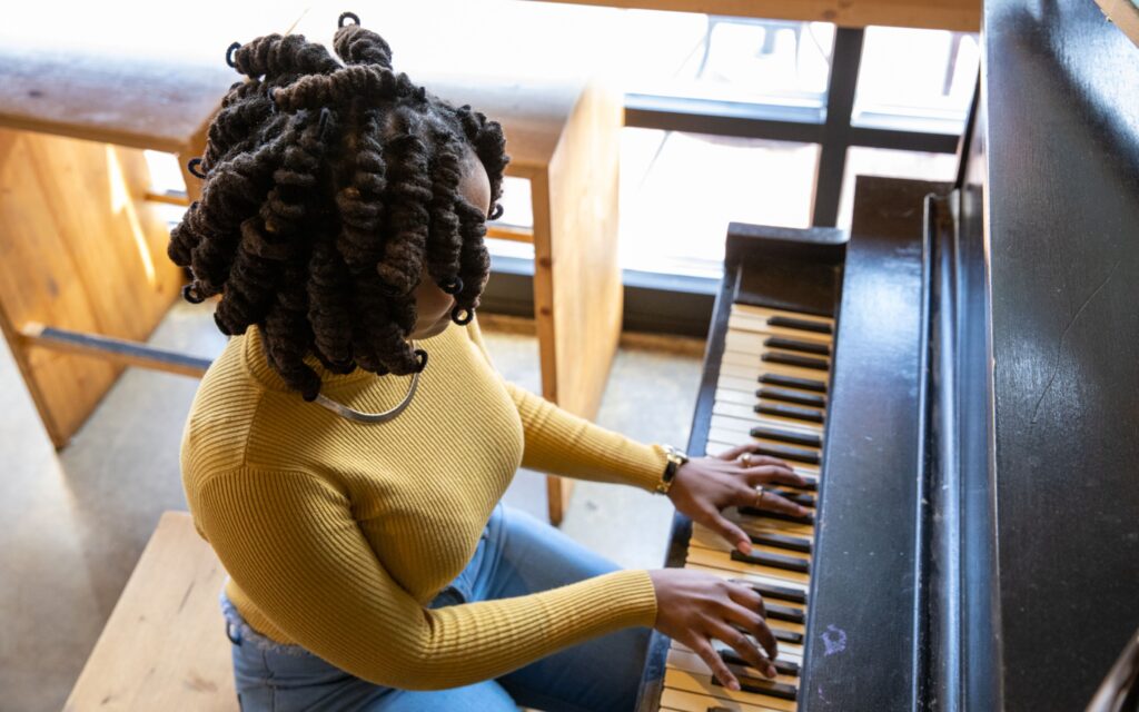 Adult woman playing piano